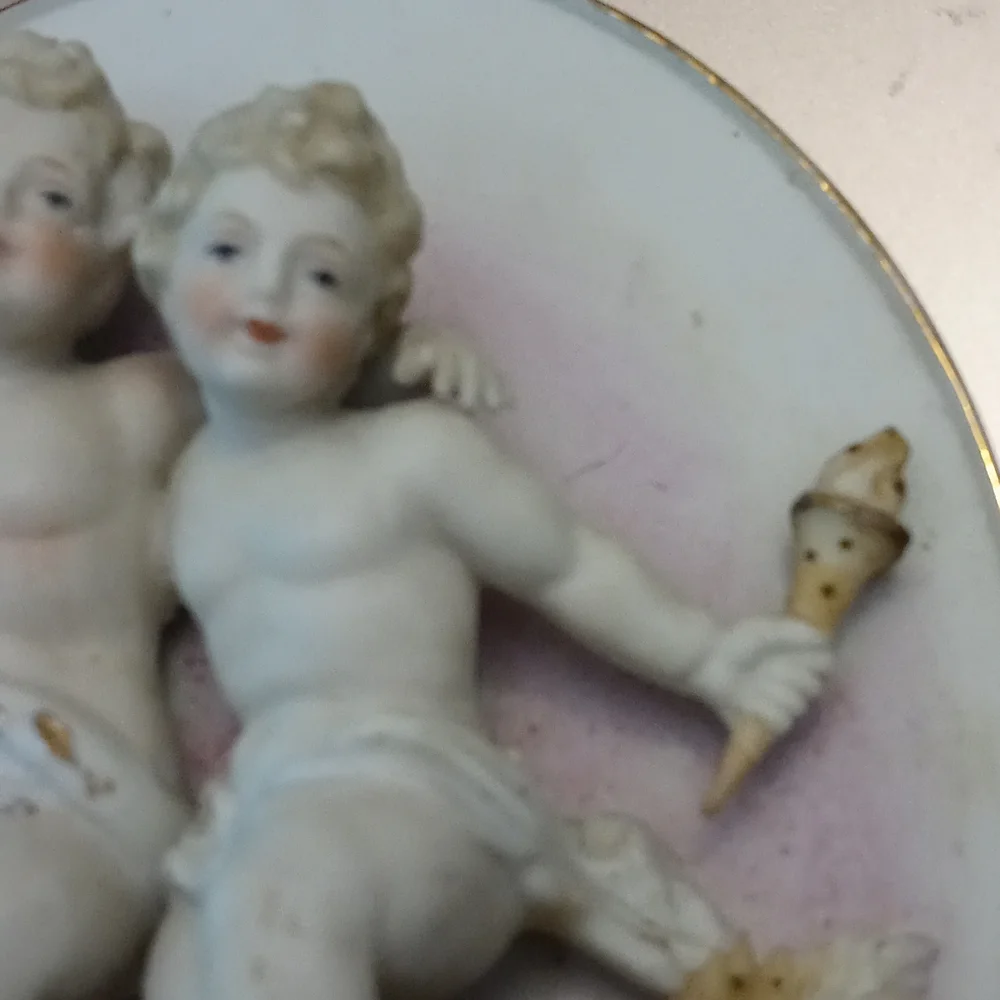 Antique cherub wall plaque